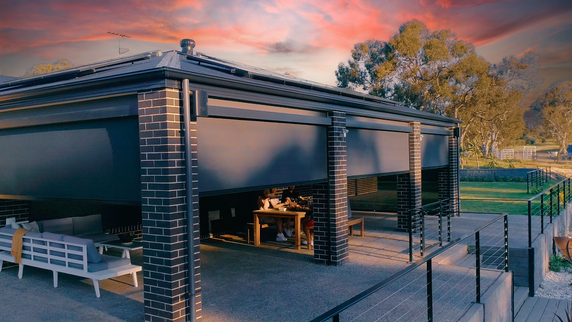 Sunset with outdoor roller blinds