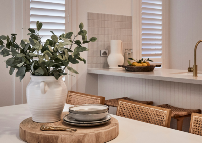 Dining room with white plantation shutters installed