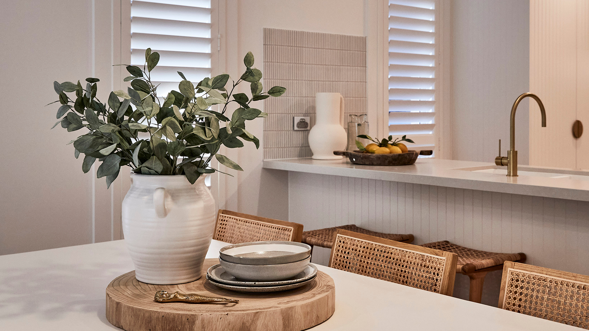 Dining room with plantation shutters installed.