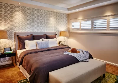 warm-coloured-plantation-shutters in bedroom