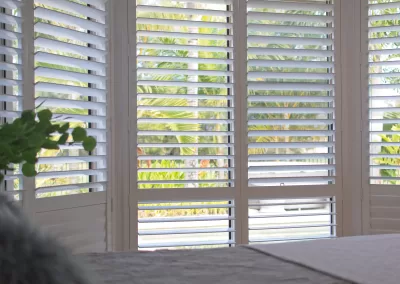 Luxury-White-Indoor-Plantation-Shutters-In-Bedroom