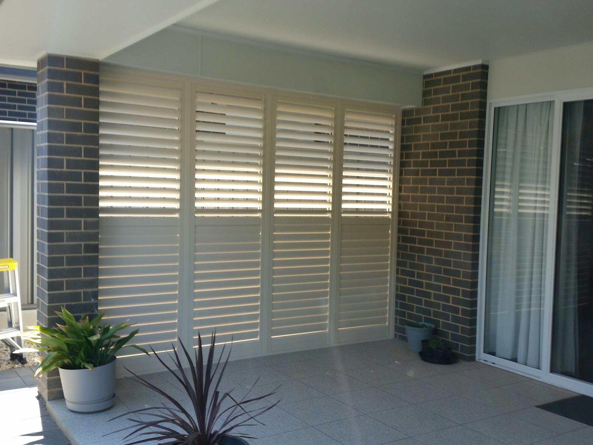 A kid closing the Plantation Shutters