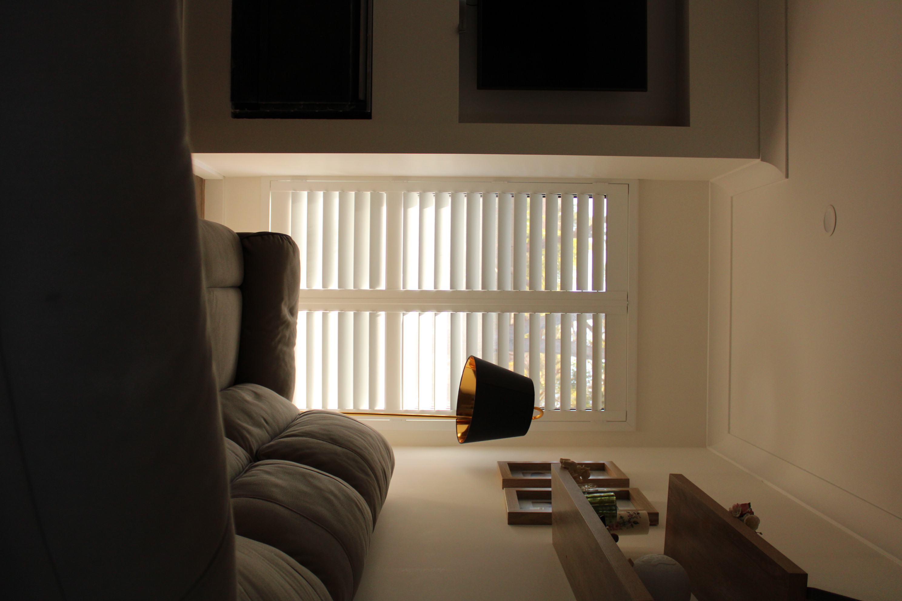 Powder-coated aluminium plantation shutters on an exterior window